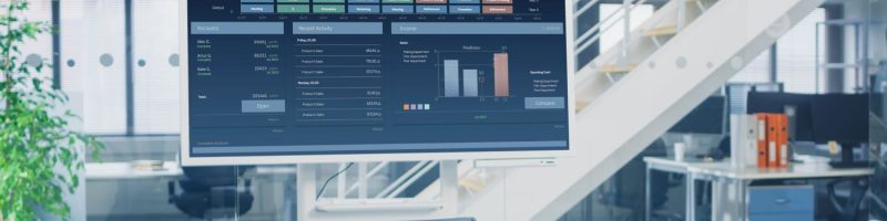 Picture of stock market on a screen in an office
